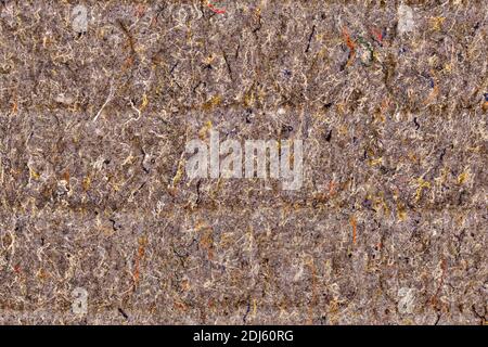 Background of beige lining with fibers from non-uniform fabric. Texture of brown felt material. Stock Photo