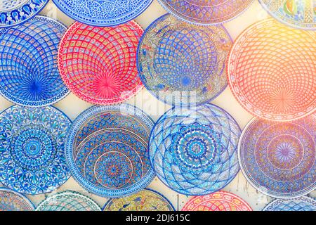Traditional arabic patterns on coloured plates at the gift shop, Sidi Bou Said, Tunisia Stock Photo