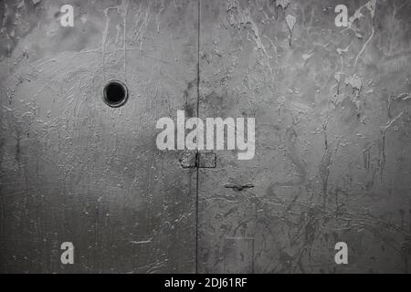 Old steel garage door painted into silver gray. Industrial background. Stock Photo