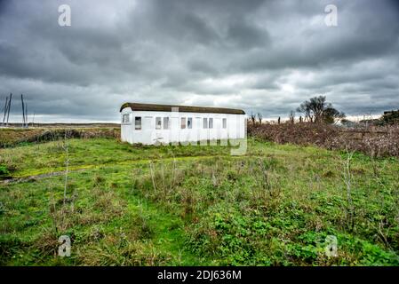 Rye Harbour, December 12th 2020: An old railway carriage, abandoned in a field in Rye Harbour Stock Photo