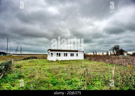 Rye Harbour, December 12th 2020: An old railway carriage, abandoned in a field in Rye Harbour Stock Photo