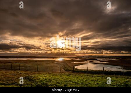 Rye Harbour, December 12th 2020: Sunset over Rye Harbour Nature Reserve and Winchelsea Beach in East Sussex Stock Photo