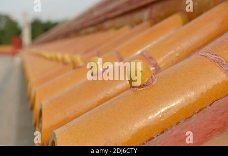 Restored orange tiling atop a wall at the Temple of the Earth, or Ditan, in Beijing, China Stock Photo