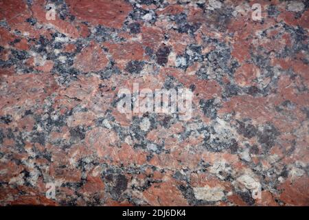 Red granite natural polished stone tile texture. Stock Photo