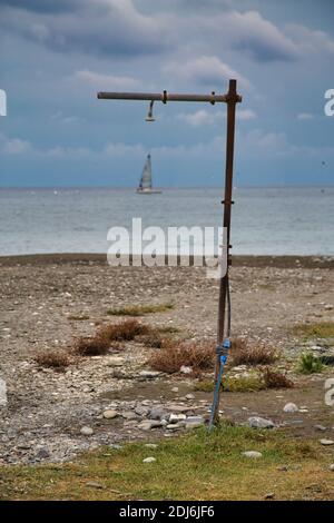 an old shower on the beach Stock Photo