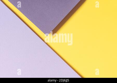 Abstract geometric paper background in yellow and gray colors. Trendy illuminating yellow and ultimate gray colours background Stock Photo