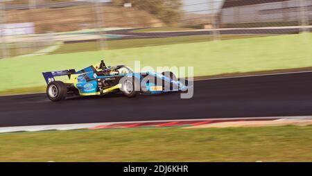 Racing car single seater modern formula in action close up blurred motion background Stock Photo
