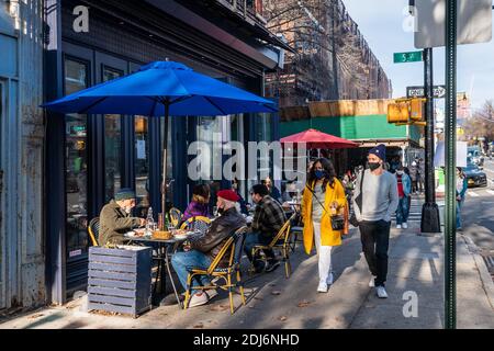 Queens, United States Of America. 13th Dec, 2020. New Yorkers enjoy an unusually warm December day while eating at a restaurant in the Park Slope neighborhood of Brooklyn, New York, on December 13, 2020. (Photo by Gabriele Holtermann/Sipa USA)(Photo by Gabriele Holtermann) Credit: Sipa USA/Alamy Live News Stock Photo
