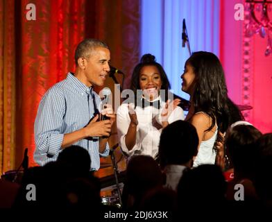 US President Barack Obama sings Happy Birthday to his daughter Malia, at the Fourth of July White House party, on July 4, 2016, Washington, DC, USA, in the East room of the White House. Malia was born 18 years ago. Guests at the party included military families and staff and their families from throughout the administration. Because of the rain the party was moved from the South Lawn to the East Room of the White House. Photo by Aude Guerrucci/Pool/ABACAPRESS.COM Stock Photo
