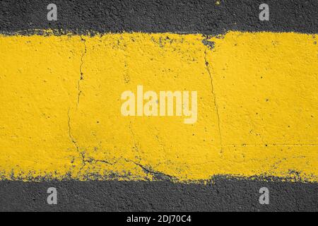 strip of yellow paint on the pavement. Use as frame or background Stock Photo