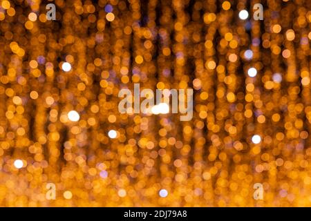Blurred defocused golden bokeh abstract background. Christmas lights pattern Stock Photo