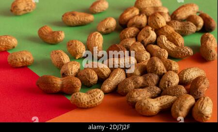 Peeled peanut on well peanuts. Peanuts in the shell raw. Stock Photo