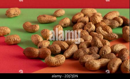 Peeled peanut on well peanuts. Peanuts in the shell raw. Stock Photo
