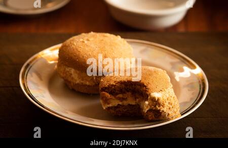 Soft chocolate cookies with marshmallow filling. toning. cookies on a plate Stock Photo