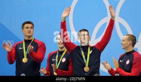 Michael Phelps rasing his hands after receiving the medal with USA team has just won 4x100 freestyle at the XXXI Summer Olympics in Rio de Janeiro, Brazil, on August 07, 2016. Photo by Giuliano Bevilacqua/ABACAPRESS.COM Stock Photo