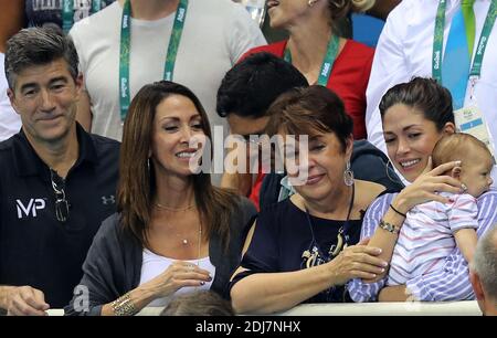 Michael Phelps' family, from left: Father in law, mother in law, his mother Debbie, his wife Natalie and his son Boomer watching as he competes and wins the gold medal during the podium ceremony for the Men's 200m butterfly as part of the swimming event at the Rio 2016 Olympic Games at the Olympic Aquatics Stadium in Rio de Janeiro on August 9, 2016. Stock Photo
