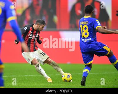 Milan, Italy. 13th Dec, 2020. AC Milan's Theo Hernandez (L) shoots during a Serie A football match between AC Milan and Parma in Milan, Italy, Dec. 13, 2020. Credit: Daniele Mascolo/Xinhua/Alamy Live News Stock Photo