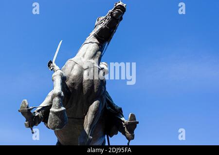 Washington DC, USA 11-29-2020: Low angle image of a bronze equiestrian statue featuring a war horse rearing with a soldier with sword in his hand. It Stock Photo