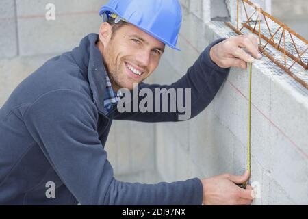 construction worker using spirit level Stock Photo