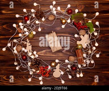 High angle view of Christmas present wrapped in craft paper. Stock Photo