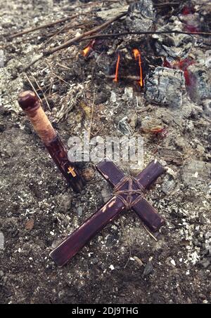 Mystical concept with voodoo objects, book and straw doll, esoteric, gothic and occult background. Stock Photo