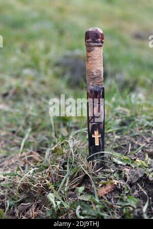 Mystical concept with voodoo objects, book and straw doll, esoteric, gothic and occult background. Stock Photo