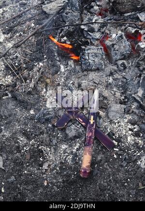 Mystical concept with voodoo objects, book and straw doll, esoteric, gothic and occult background. Stock Photo