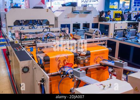 Fully automatic high speed shopping bag making machine at exhibition Stock Photo