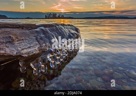 Background of icicles in the sunset light Stock Photo