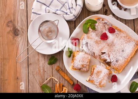 Bougatsa - Greek puff pastry with cream. Stock Photo