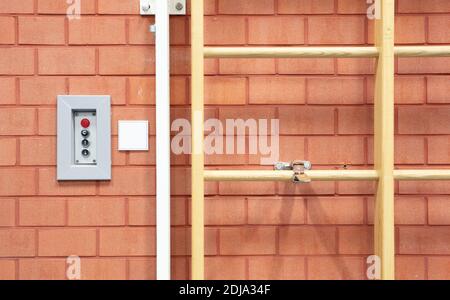 Empty gym in a school with a Swedish wall strapped to the wall Stock Photo