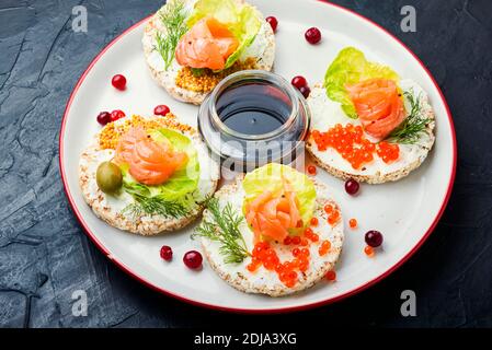 Open sandwiches with salmon and cream cheese.Bread with salmon fillet Stock Photo