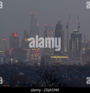 London, UK. 14 December 2020. City of London skyscrapers illuminated before sunrise with christmas lights at The Shard (right) and Tower 42, previously the NatWest Tower (left), displaying a Christmas jumper. Credit: Malcolm Park/Alamy Live News. Stock Photo