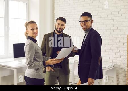 Group of business people meeting in office, discussing data reports and new projects Stock Photo