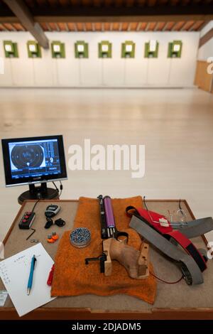 Firing position (air gun, pellets, electronic scoring) on a table, at the shooting range. Stock Photo