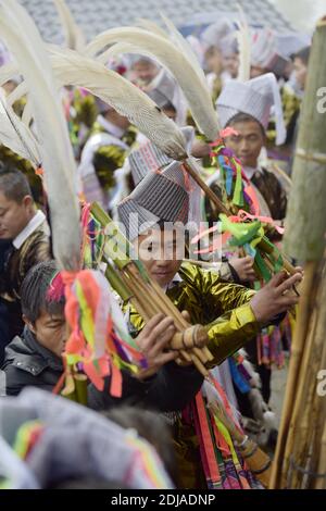 Congjiang, Congjiang, China. 14th Dec, 2020. Guizhou, CHINA-On December 13, 2020, miao people gathered at the Lusheng Hall in Qiandongnan Miao Dong Autonomous Prefecture, Southwest China's Guizhou Province. Men played the lusheng and girls danced to celebrate the annual Lusheng Festival, praying for favorable weather and abundant crops. Young men and women also used the festival to find their ideal mates. Credit: SIPA Asia/ZUMA Wire/Alamy Live News Stock Photo