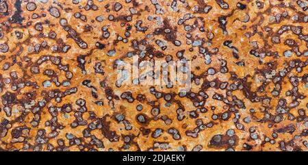 Orange brown slate stone slab with abstract dotted pattern Stock Photo