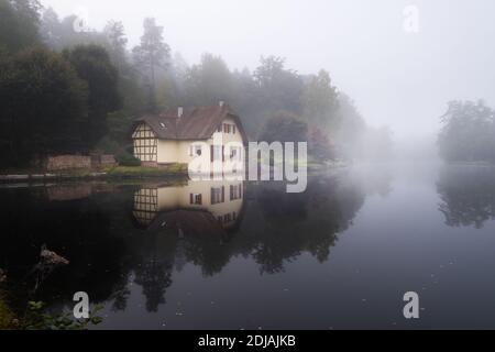 Single house on a lake in Ludwigswinkel, Germany Stock Photo