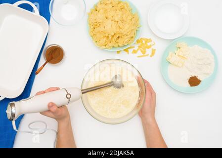 step-by-step recipe for the holiday of Hanukkah, a traditional Kugel pie with noodles and custard, sand crumbs on top. the ingredients in the dishes o Stock Photo