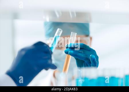 close up. scientists compare liquids in test tubes. Stock Photo