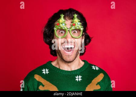 Close-up portrait of his he nice attractive glad cheerful cheery brunet guy wearing green childish comic specs having fun Eve Noel sale isolated Stock Photo