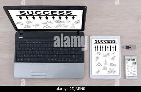 Success concept shown on different information technology devices Stock Photo