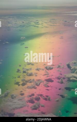 Aerial view of the Tyrrhenian sea. Colors produced when light is passed through the airplane window. Stock Photo