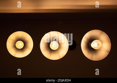 Three round lamps on the ceiling, bottom view Stock Photo
