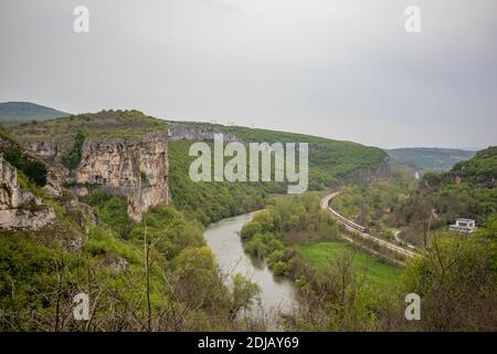 Iskar river gorge moody day landscape view from above near main entrance of Prohodna cave, Northwestern Bulgaria Stock Photo