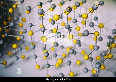 Old Wooden Molecular Model. Atomic Structure And Bonding. Chemistry background. Stock Photo