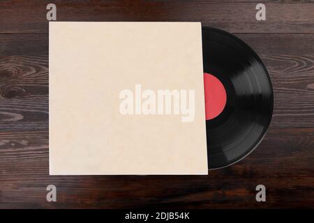 Old vinyl records isolated on wooden background Stock Photo