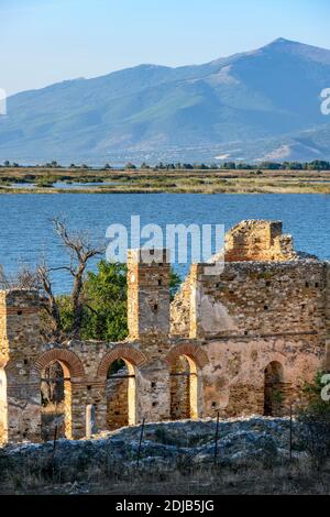 The 10 century ruines of Saint Achilleios Basilica on the island of Agios Achilleios on Mikri Prespa lake, Macedonia, Northern Greece. Stock Photo