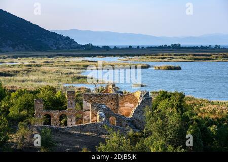 The 10 century ruines of Saint Achilleios Basilica on the island of Agios Achilleios on Mikri Prespa lake, Macedonia, Northern Greece. Stock Photo