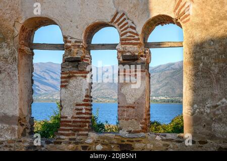 Mikri Prespa Lake seen through The 10 century ruines of Saint Achilleios Basilica on the island of Agios Achilleios on Mikri Prespa lake, Macedonia, N Stock Photo